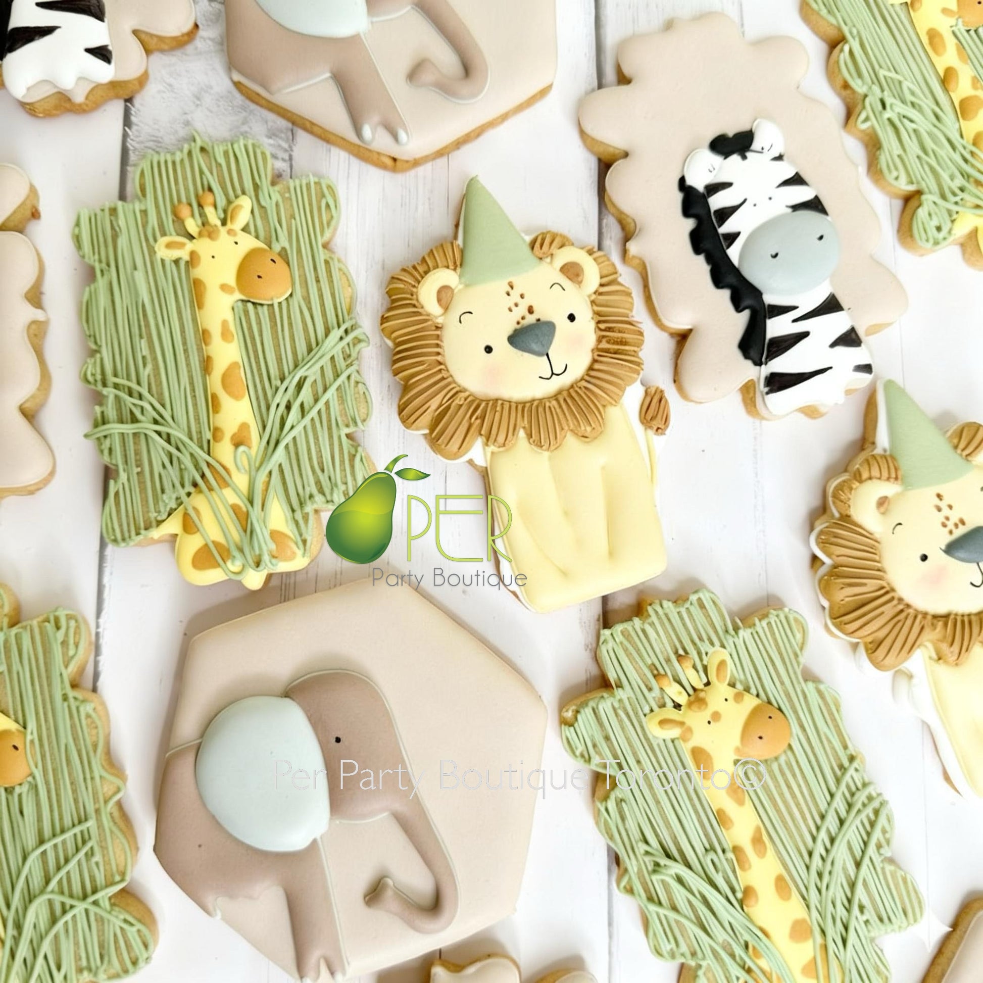 Decorative cookies shaped like animals on a white surface with 'Pepi Party Boutique' branding.